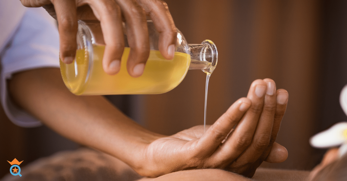 therapist using massage oils